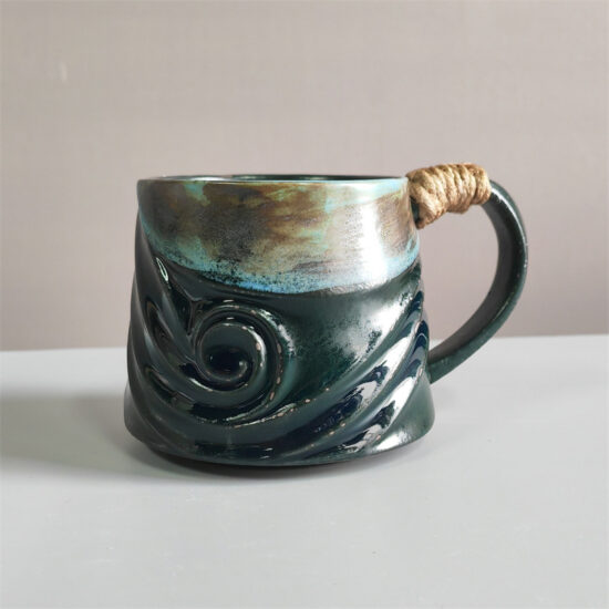 Unique irregular ceramic coffee mug with kiln-glazed surface