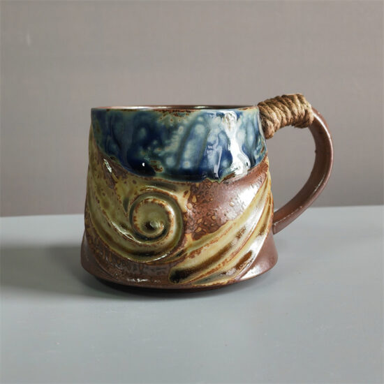 Unique irregular ceramic coffee mug with kiln-glazed surface
