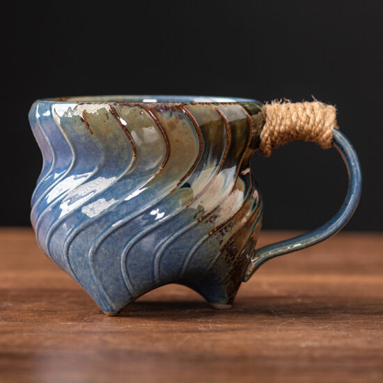 Unique irregular ceramic coffee mug with kiln-glazed surface