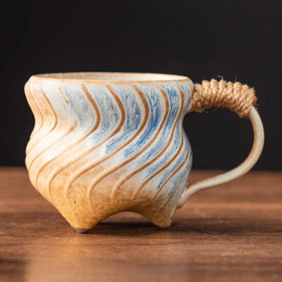 Unique irregular ceramic coffee mug with kiln-glazed surface