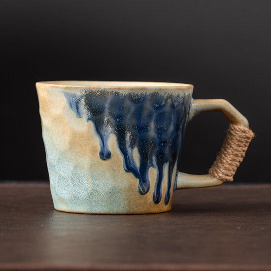 Kiln-glazed ceramic coffee mug with artistic finish