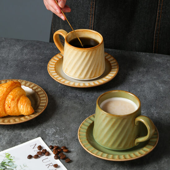 Vintage hand-painted striped ceramic mug and saucer set