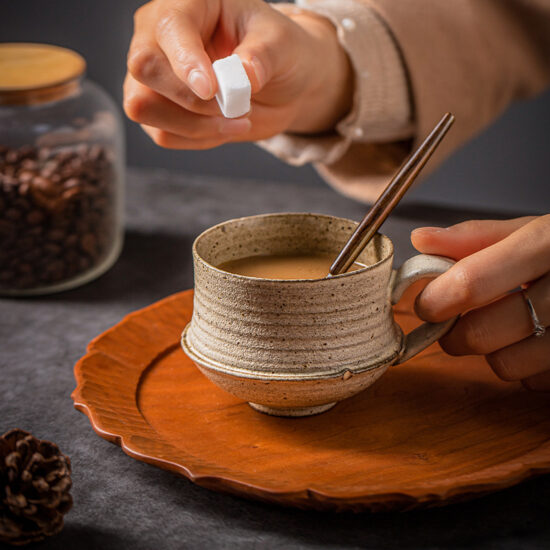Handmade rustic ceramic milk cup with spoon, irregular shape coffee mug