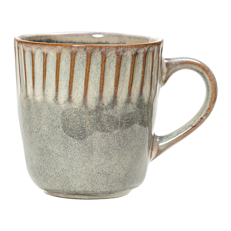 Single reactive glaze ceramic mug on white background