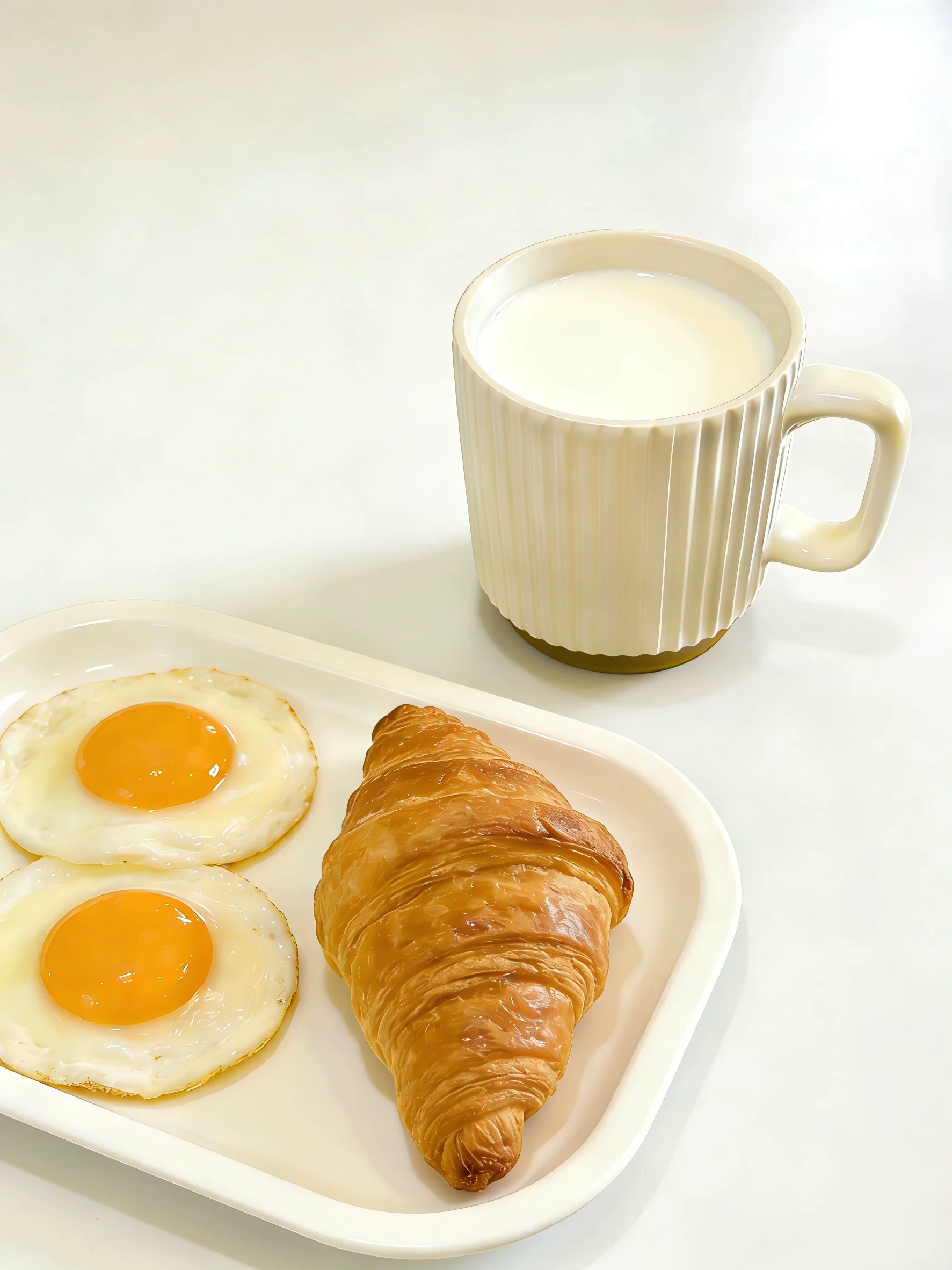 Ribbed ceramic mug beside a breakfast plate