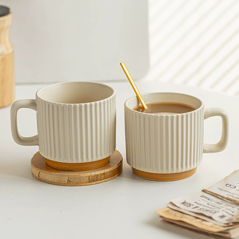 Pair of ribbed ceramic mugs with wood color base