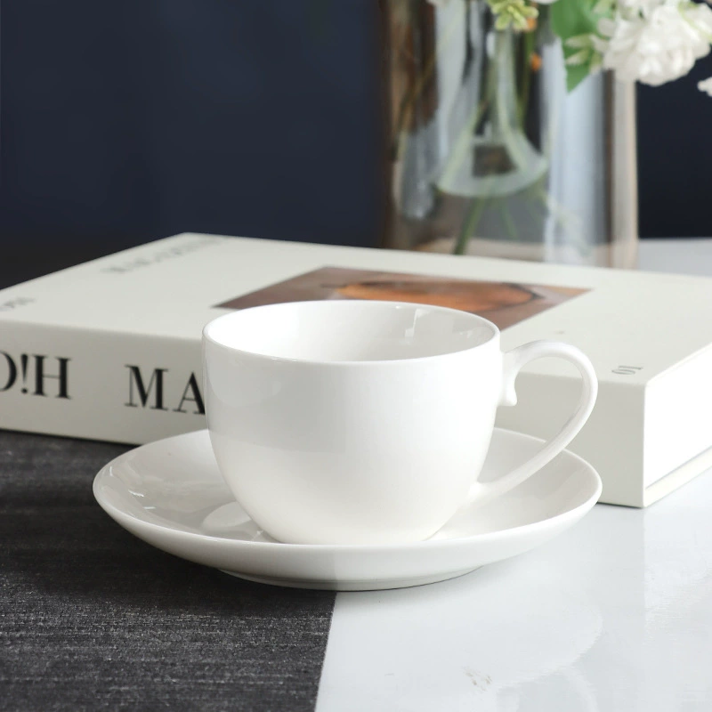 Smooth white ceramic coffee cup with matching saucer